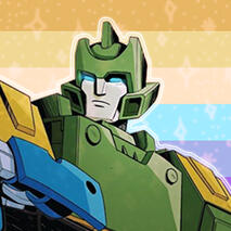 Springer in front of the she/they gay flag